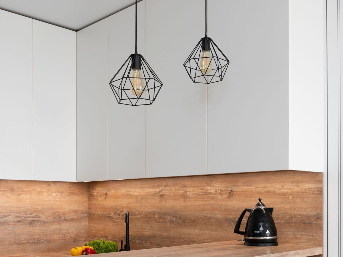 Geometric pendant lights over a wooden kitchen counter
