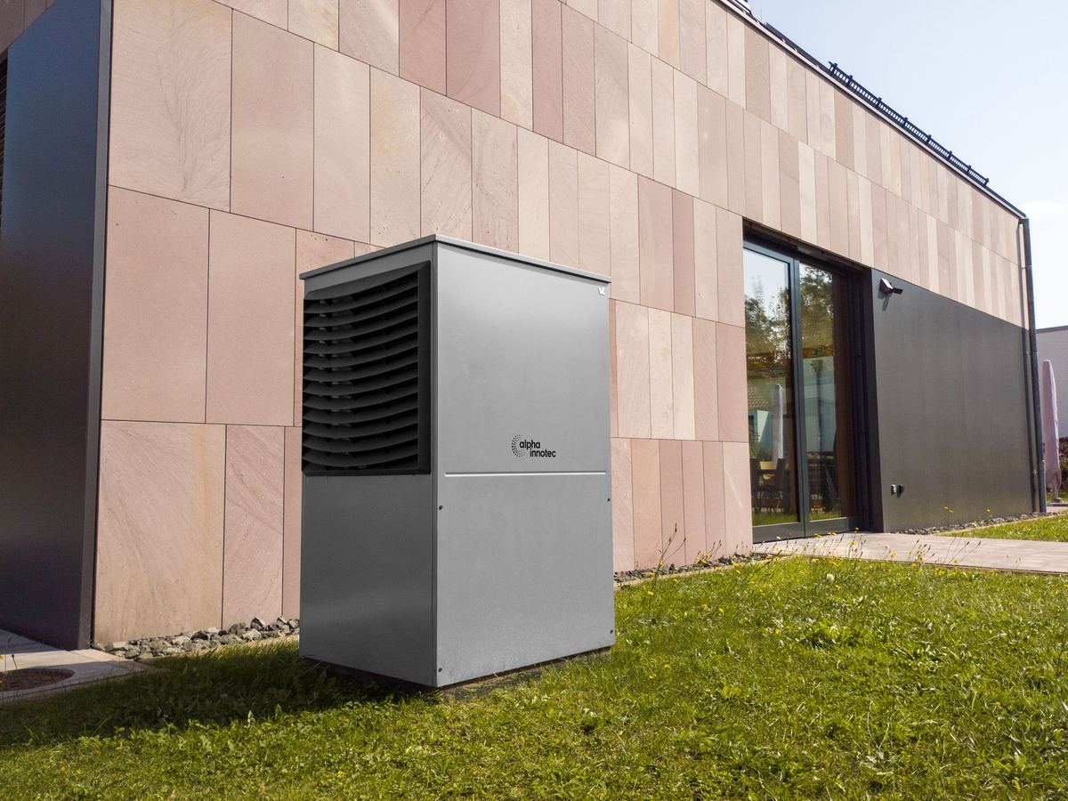 Modern outdoor heat pump unit installed beside a contemporary home