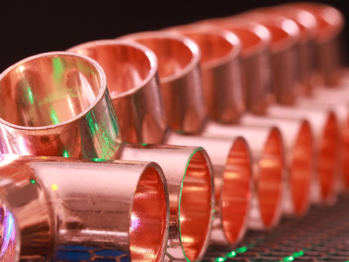 Close-up of shiny copper pipe fittings